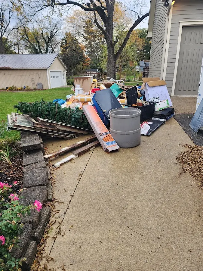 Dumpster being loaded with debris for 3 Yard Dumpster Rental in Coarsegold